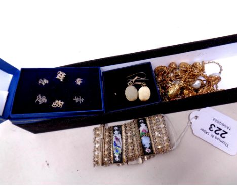 A collection of Oriental style jewellery including panel cuff bracelet, oval earrings, necklace and silver earrings.