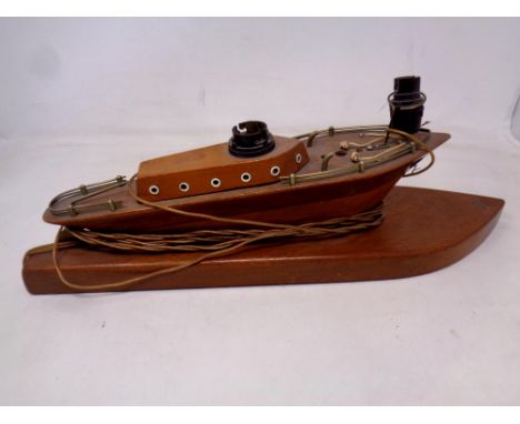 A mid 20th century wooden table lamp in the form of a pleasure cruiser 