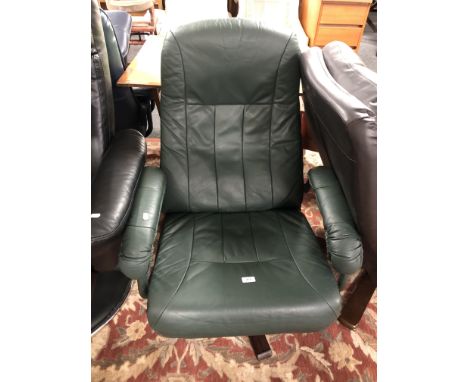 A 20th century Danish green leather manual reclining swivel armchair 