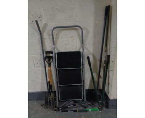 A set of three thread folding steps and a small quantity of garden tools 