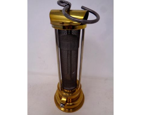 A reproduction E William Thomas brass miners lamp.