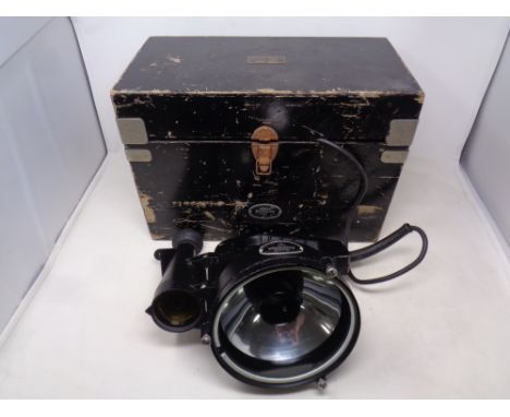 An Aldis Longrange signaling lamp MKX fitted in wooden box  CONDITION REPORT: continental wiring 