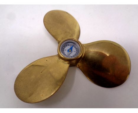 A miniature brass boat propeller compass, diameter 10cm 