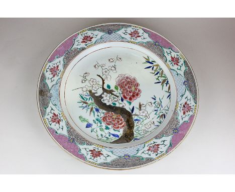 A Chinese porcelain charger decorated with cherry blossom and bamboo with bright enamel border, 39cm