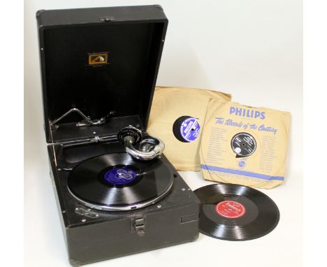 HMV vintage gramophone in black leatherette case together with four records.   Condition Report.  In need of some attention, 