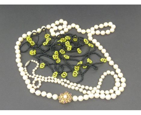 Cultured pearl necklace on 9ct gold snap, another and a bead necklace.