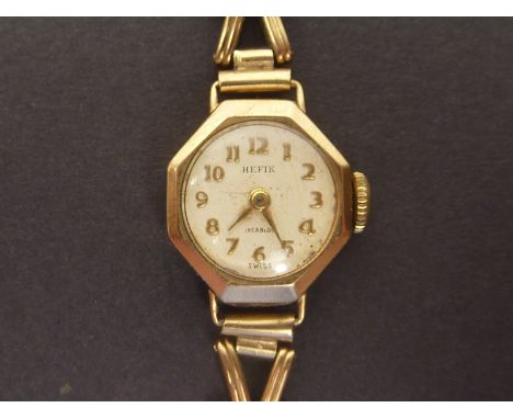 Ladies Hefix 9ct gold wristwatch, fifteen jewel Hefix movement, on 9ct gold arrow link strap.