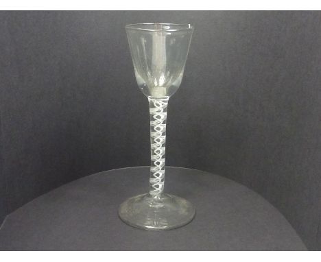 Georgian wine / cordial glass, the small funnel bowl on drawn stem with opaque white twist stem, domed circular foot with sna