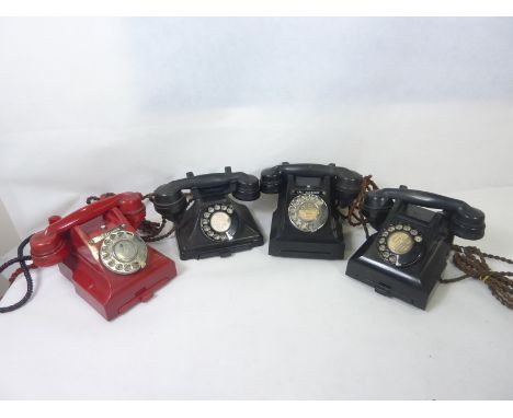Four vintage Bakelite telephones, two black 332 type phones, one black 232 type phone and one red 312 type phone. (4)