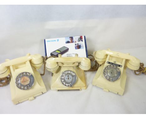 Three vintage Bakelite telephones in ivory; two 332 type and one 238 type, also an old Ericsson A1018S mobile phone, boxed. (