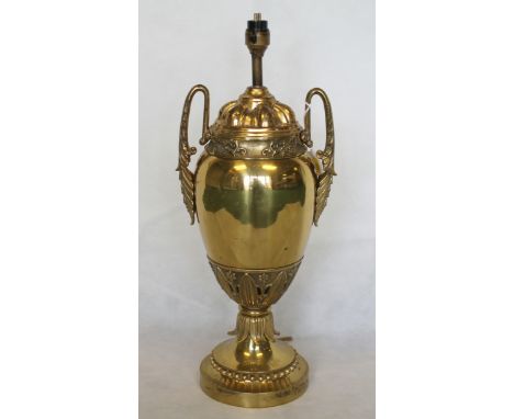 Early 20th century brass table lamp of twin handled urn form, with moulded foliate borders, 47cm high (electrical testing / r