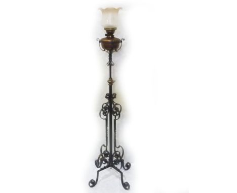 Victorian wrought iron scroll work standard oil lamp with reservoir and shade.