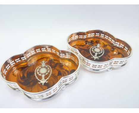 Pair of e.p. decanter stands of quatrefoil shape.