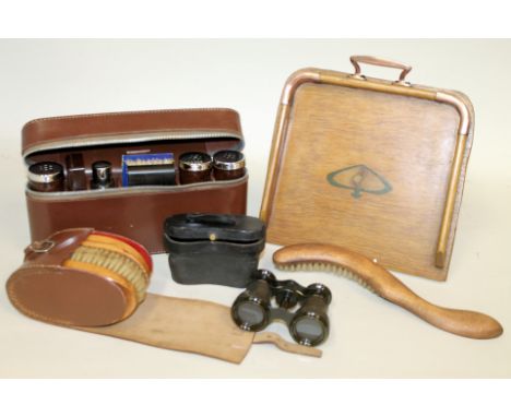 Vintage gentleman's travel grooming set, the leather case containing bakelite jars and boxes, brushes and a glass cologne bot