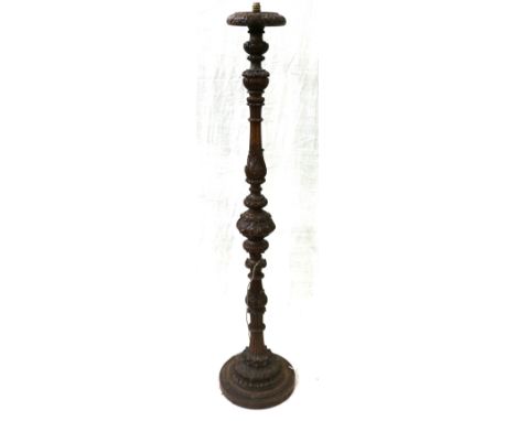 Ornate carved mahogany standard lamp, the column decorated with acanthus, scrolls and reeded decoration, 171cm.