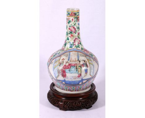 Chinese 19th century Canton famille rose bottle vase decorated with figures on horseback and in an interior setting, on carve