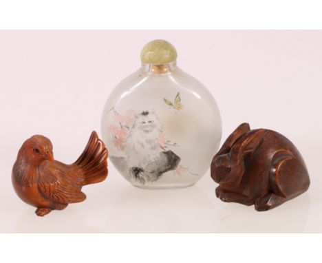 Carved boxwood netsuke of a bird, two character mark to base another of a hare and an interior painted glass snuff bottle 7cm