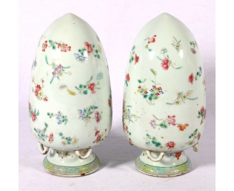 Pair of Chinese famille verte lanterns with suspension loops, the pale celadon porcelain bodies decorated with flower sprigs,