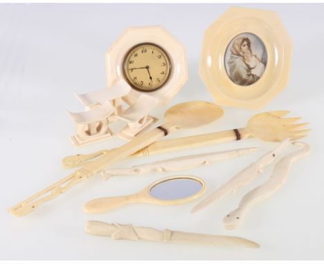 Art Deco ivory travel clock, 8.5cm, an ivory framed portrait miniature, salad servers, miniature hand mirror and other items.