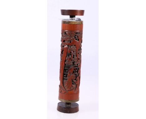 19th century Chinese pierced and carved bamboo perfume stick depicting figures in a forested garden setting, red silk to the 