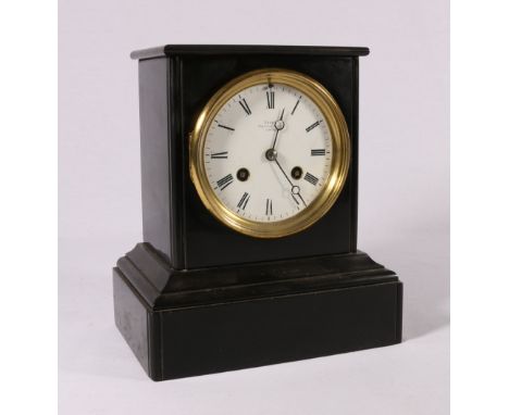 Grohe black slate mantel clock with enamel Roman dial and cylinder movement striking on a bell, 22cm.