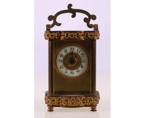 French carriage clock with enamelled ring chapter dial, pierced ormulu scrolling frieze, 16cm high