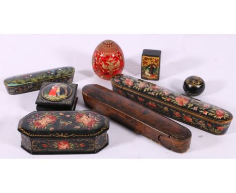 Russian lacquer pen box decorated with township and hunting scenes, 20cm, six other later boxes and a ruby glass egg decorate