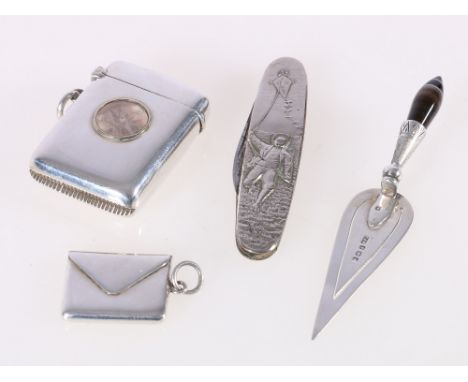 Silver vesta case, with compass 4.5cm, a silver envelope stamp case, 2.5cm, a silver trowel bookmark with agate handle, 9cm a