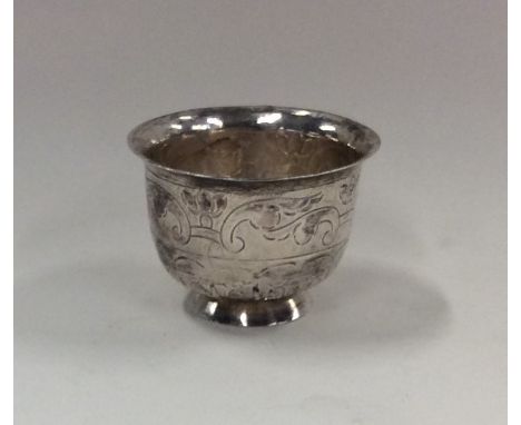 An unusual 18th Century Russian silver tot decorated with flowers on spreading foot. Punched to base. Approx. 23 grams. Est. 