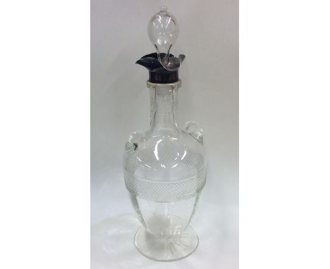 A stylish silver dimple sided decanter with silver collar. Sheffield. Est. £50 - £80.
