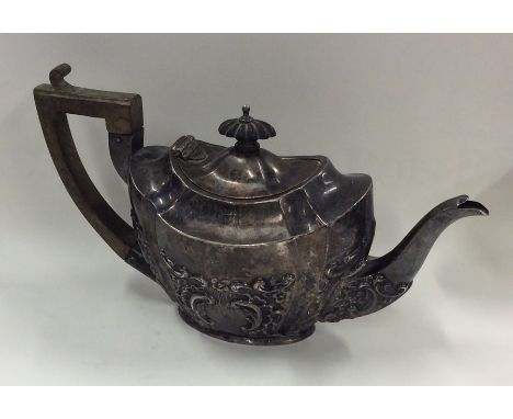 An embossed bachelor's three piece silver teapot. Chester. Approx. 263 grams. Est. £120 - £150.