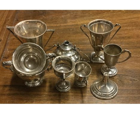 A collection of old silver trophy cups. Approx. 357 grams. Est. £30 - £50.