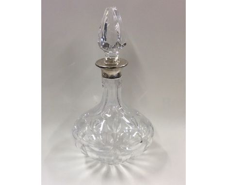 A silver and cut glass decanter together with stopper. Est. £30 - £50.