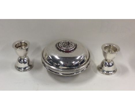 A circular silver travelling candlestick in domed case. Approx. 116 grams. Est. £70 - £80.