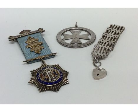 A silver and enamel medallion together with one other etc. Approx. 80 grams. Est. £20 - £30.