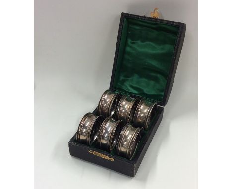 A cased set of six silver napkin rings. Chester. Approx. 45 grams. Est. £60 - £80.