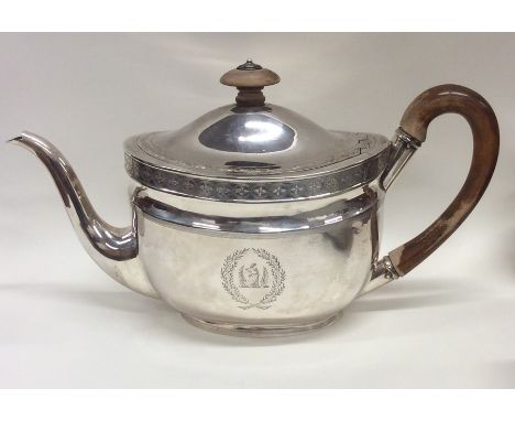 A good Georgian silver bright cut teapot with crested sides. London 1803. Approx. 478 grams. Est. £250 - £350.