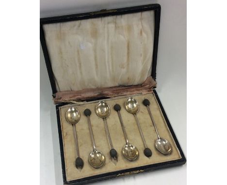 A boxed set of six enamel and silver bean top coffee spoons. Sheffield. By HD. Approx. 48 grams. Est. £25 - £35.