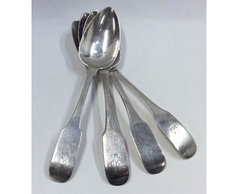 A set of four heavy fiddle pattern Irish silver serving spoons with crested terminals. Approx. 260 grams. Est. £150 - £180.