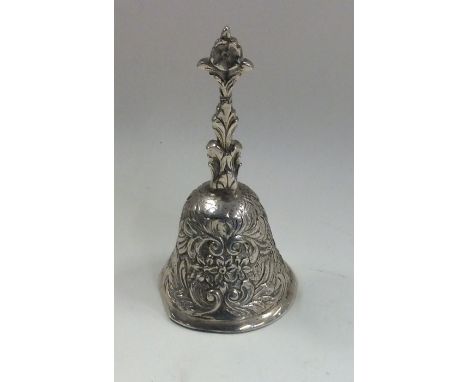 A Dutch silver model of a bell attractively chased with flowers. Approx. 53 grams. Est. £50 - £80.