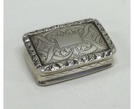 A Georgian silver hinged top vinaigrette with chased decoration. Birmingham. By Nathaniel Mills. Approx. 19 grams. Est. £200 