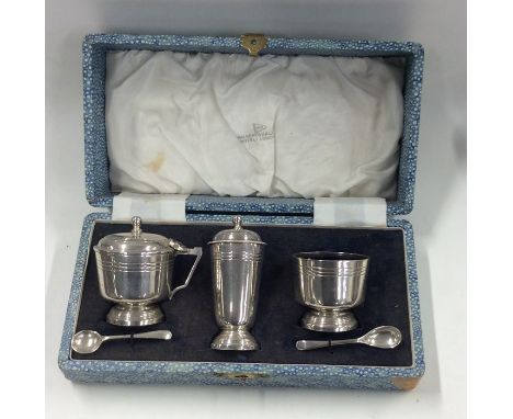 A good boxed three piece silver cruet set. Birmingham. By Mappin &amp; Webb. Approx. 200 grams. Est. £40 - £60.