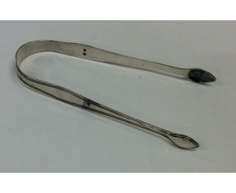 A pair of Georgian silver sugar tongs. London. By Hester Bateman. Approx. 30 grams. Est. £40 - £60.