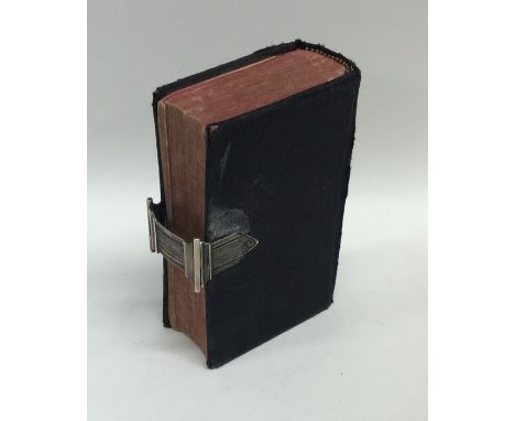 An Antique silver mounted bible with leather top. Est. £40 - £60.