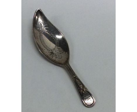 A good Georgian silver bright cut caddy spoon with engraved decoration. Approx. 14 grams. Est. £60 - £80.
