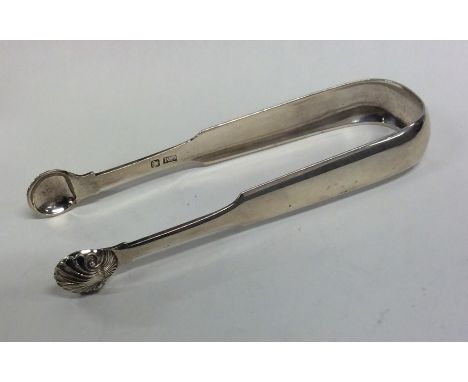 A pair of heavy Provincial silver fiddle pattern sugar tongs. Punched, 'CM'. Approx. 60 grams. Est. £50 - £80.