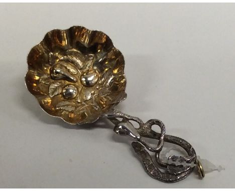 An attractive Victorian silver gilt caddy spoon decorated with fruit. London. Approx. 13 grams. Est. £100 - £150.