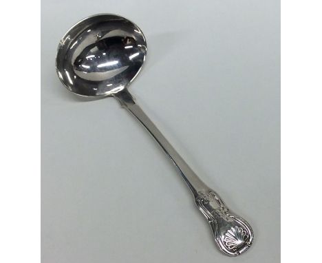 A silver hourglass pattern cream ladle. London. By IS. Approx. 46 grams. Est. £30 - £40.