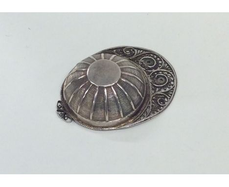 An attractive Georgian silver jockey cap caddy spoon. Birmingham. By J Taylor. Approx. 11 grams. Est. £120 - £150.