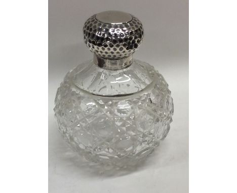 A silver mounted hobnail cut scent bottle. Est. £30 - £50.